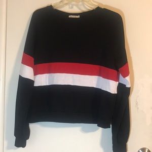 Long sleeved black, red, and white top